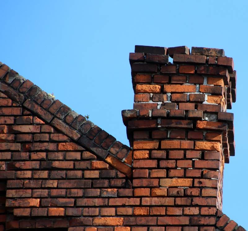 Signs Your Riverview Home Needs a Chimney Inspection Damaged chimney on an Riverview home showing cracks and missing mortar